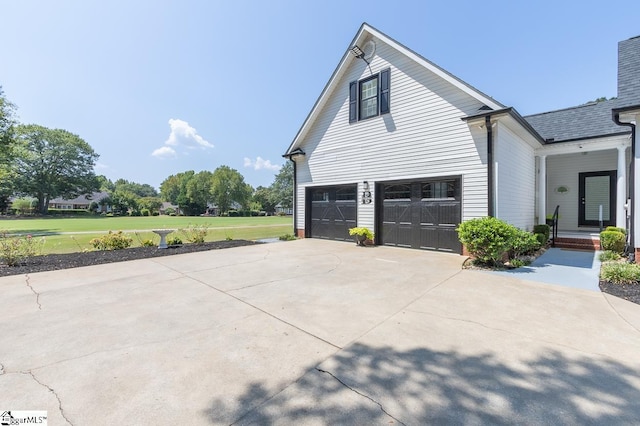 view of property exterior with a garage