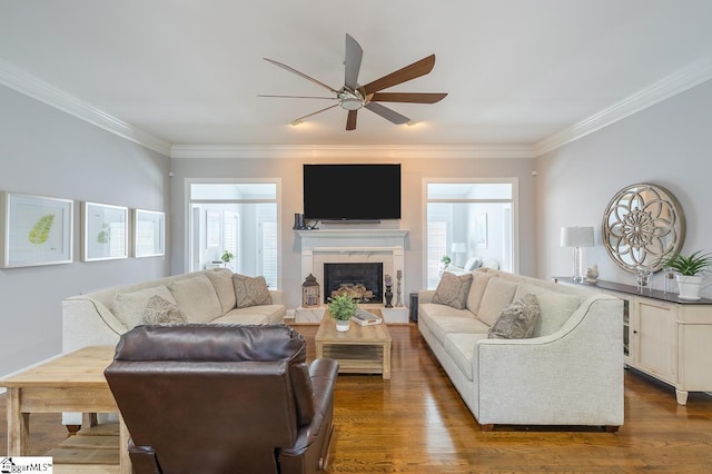 living room featuring ceiling fan, dark hardwood / wood-style flooring, and ornamental molding