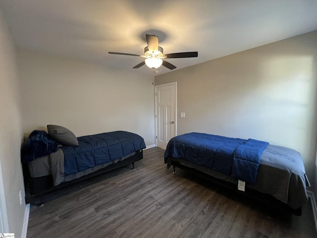 bedroom with ceiling fan and dark hardwood / wood-style flooring