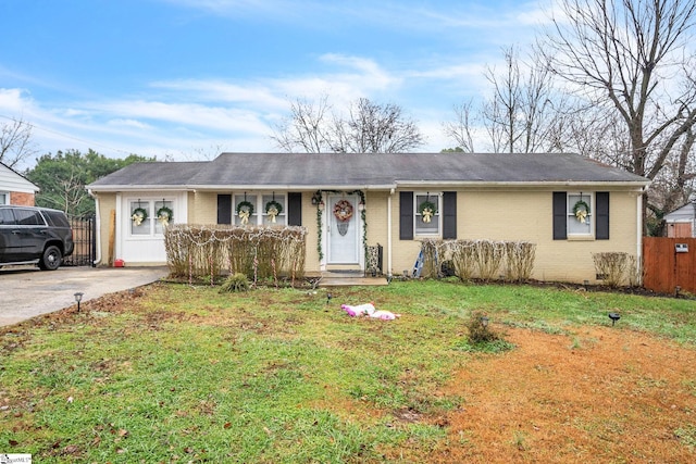 ranch-style house with a front lawn