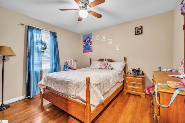 bedroom with hardwood / wood-style flooring and ceiling fan