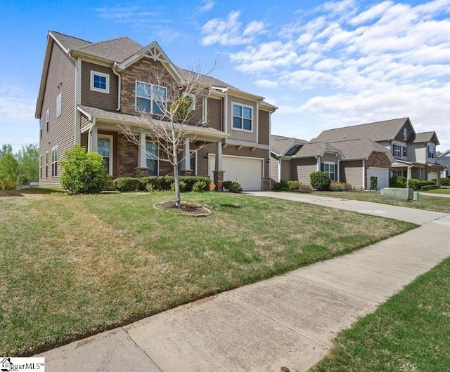 view of front of home with a garage and a front lawn