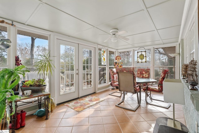 sunroom / solarium with ceiling fan and french doors