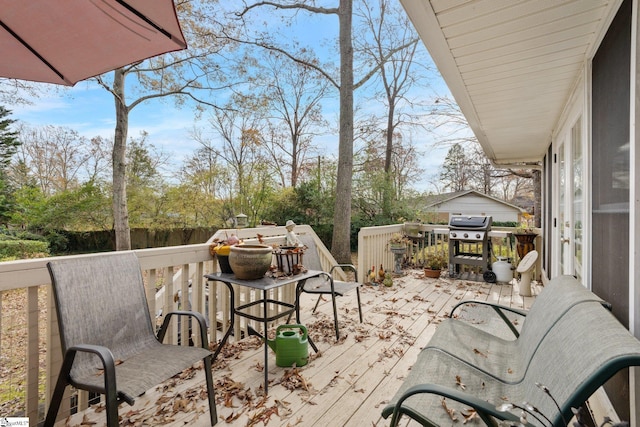 wooden deck featuring grilling area