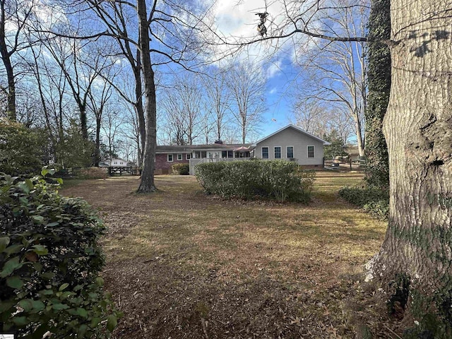 rear view of house with a lawn