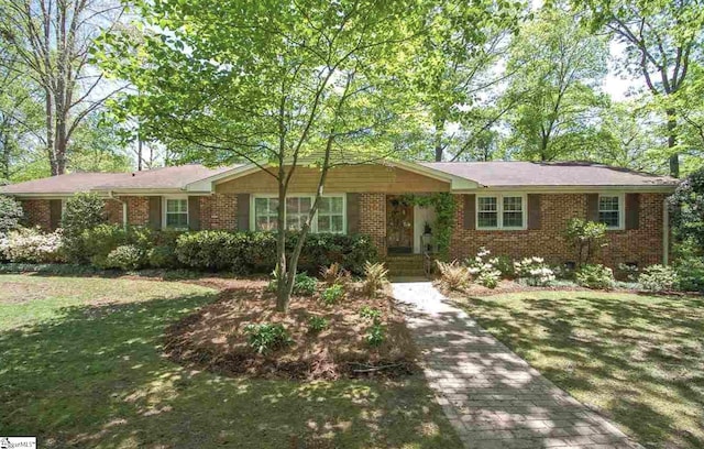 ranch-style house with a front lawn