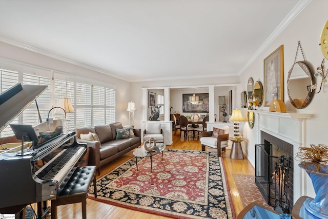 living room featuring ornamental molding and hardwood / wood-style floors