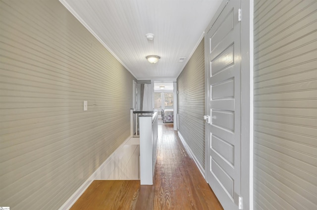 corridor with light hardwood / wood-style flooring