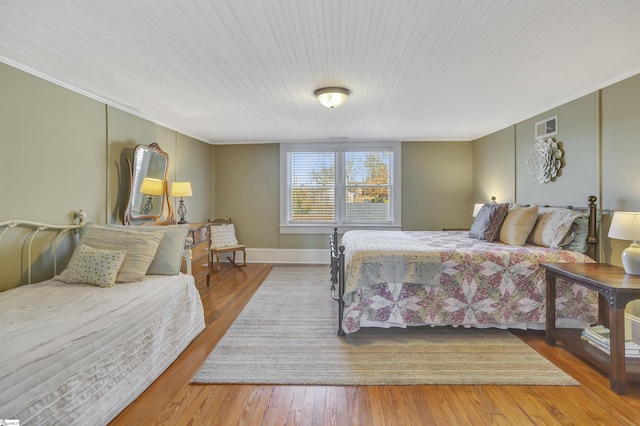 bedroom featuring wood-type flooring