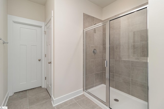 bathroom featuring tile patterned floors and walk in shower