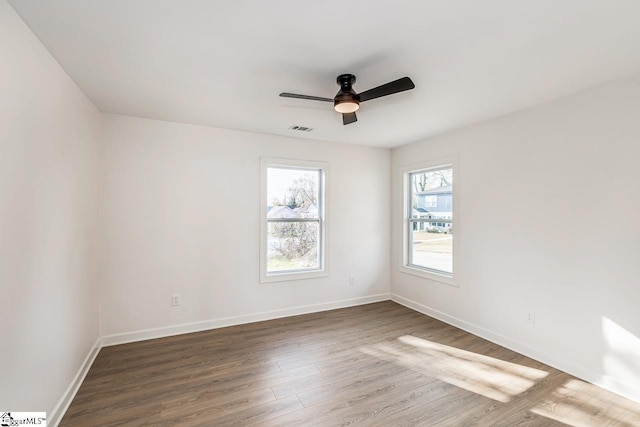 unfurnished room featuring hardwood / wood-style floors and ceiling fan