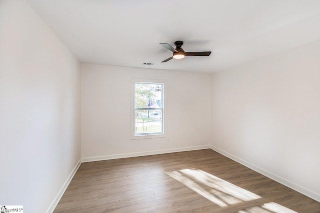 unfurnished room featuring ceiling fan and wood-type flooring