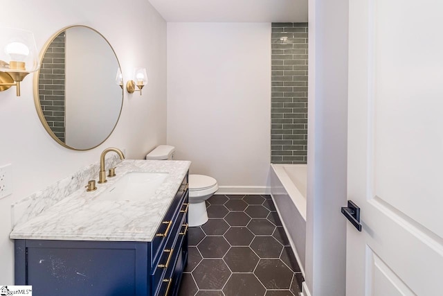 bathroom with tile patterned floors, vanity, and toilet