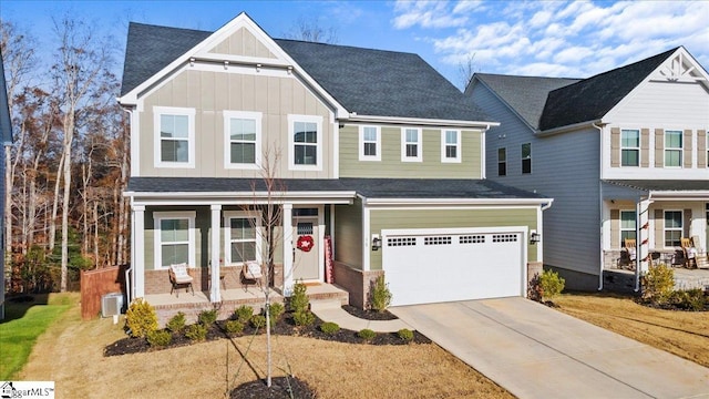 view of front of property with a porch and a garage