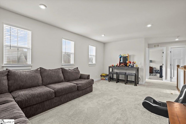 living room featuring light carpet