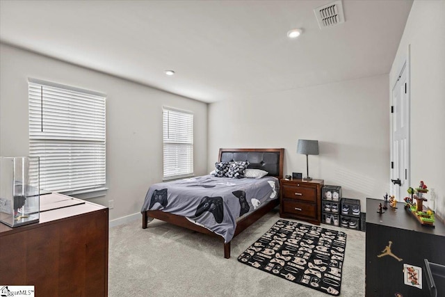 bedroom with light colored carpet