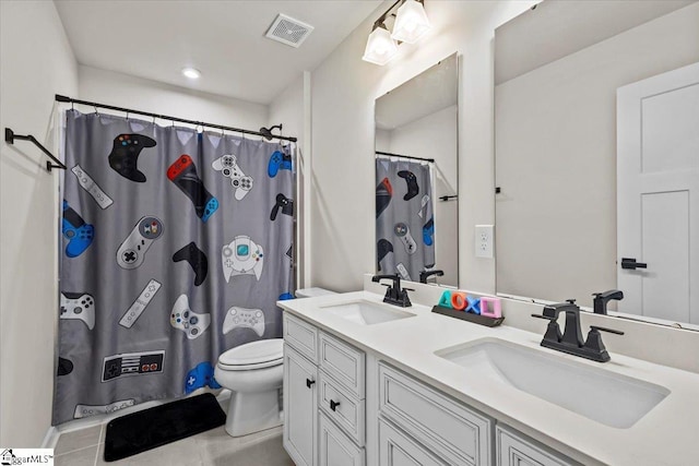 bathroom with tile patterned flooring, vanity, toilet, and a shower with curtain