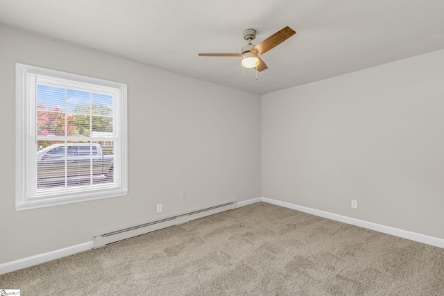 carpeted empty room featuring ceiling fan and a baseboard radiator