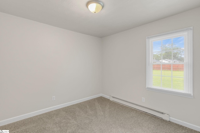 carpeted spare room featuring a baseboard radiator