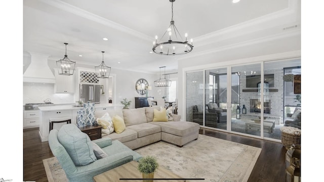 living room featuring dark hardwood / wood-style flooring and crown molding