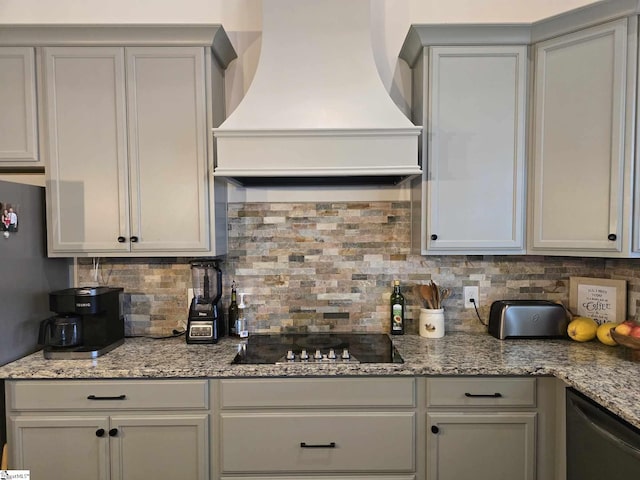 kitchen with dishwasher, light stone counters, backsplash, black electric cooktop, and custom range hood