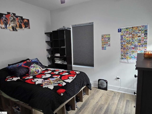 bedroom featuring ceiling fan and wood-type flooring