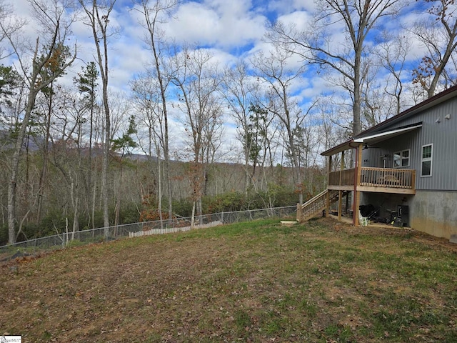 view of yard featuring a wooden deck