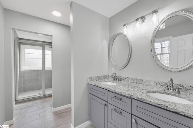 bathroom with vanity and an enclosed shower