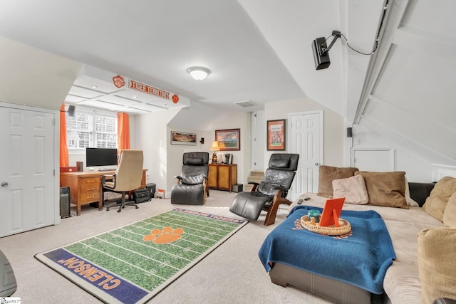 carpeted bedroom with vaulted ceiling