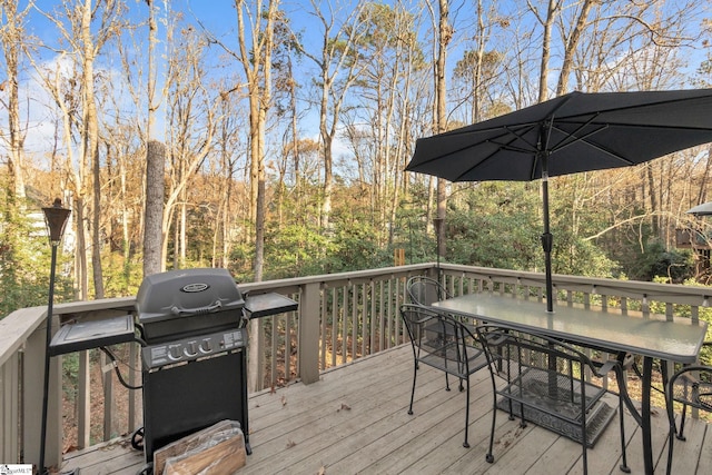 wooden terrace with a grill