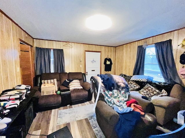 living room featuring wood-type flooring and wooden walls