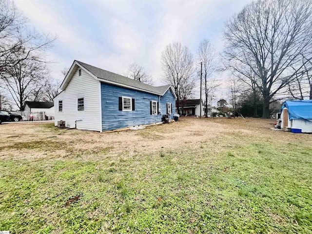 view of property exterior featuring a lawn