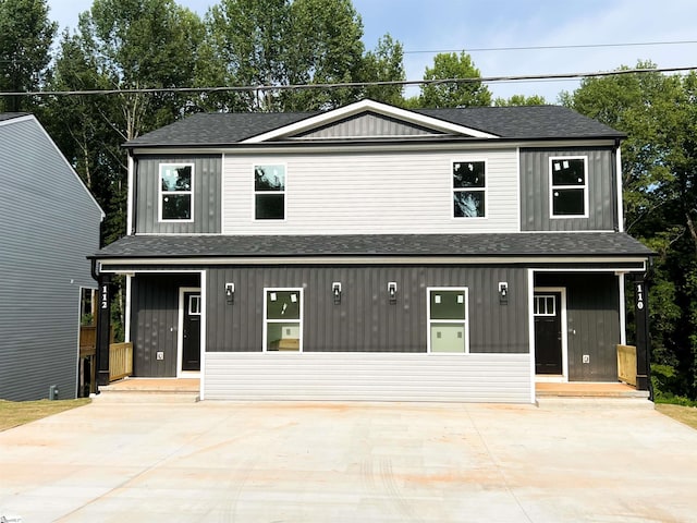 view of property featuring covered porch