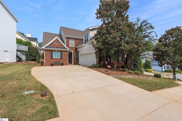 view of front of property featuring a garage and a front lawn