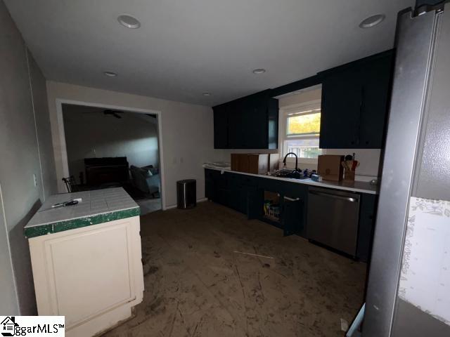 kitchen featuring stainless steel dishwasher and sink