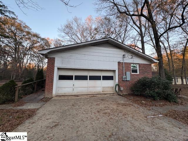 view of property exterior featuring a garage