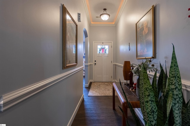 doorway to outside featuring dark hardwood / wood-style floors and crown molding