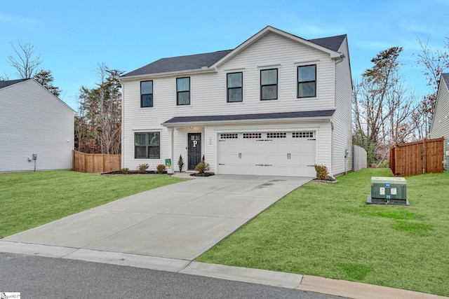 view of front of property with a garage and a front yard