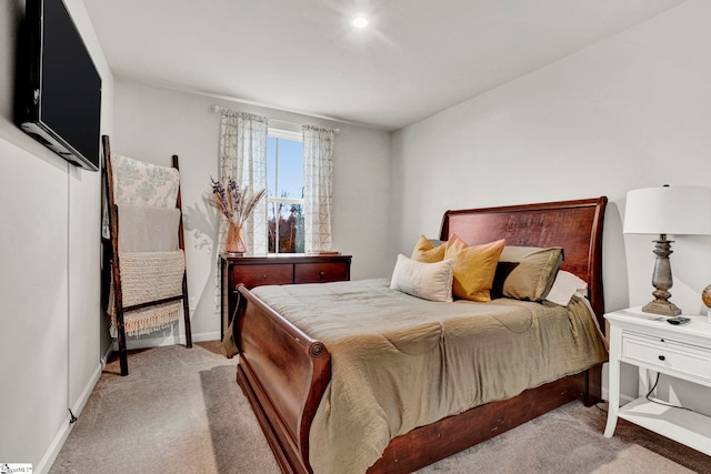 bedroom featuring light colored carpet