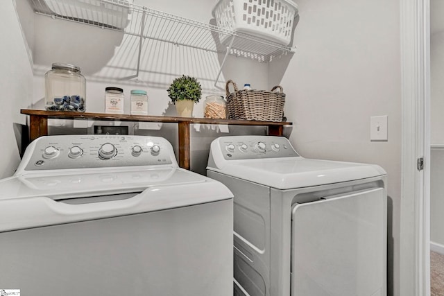 washroom featuring washer and clothes dryer