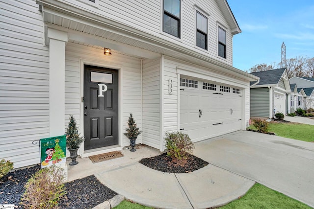 view of exterior entry with a garage