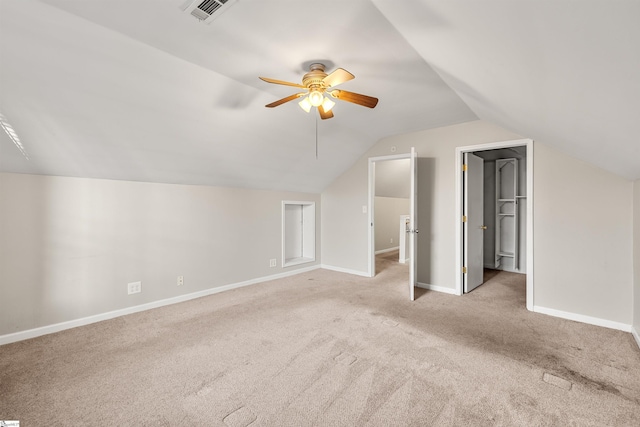 additional living space featuring ceiling fan, light carpet, and lofted ceiling