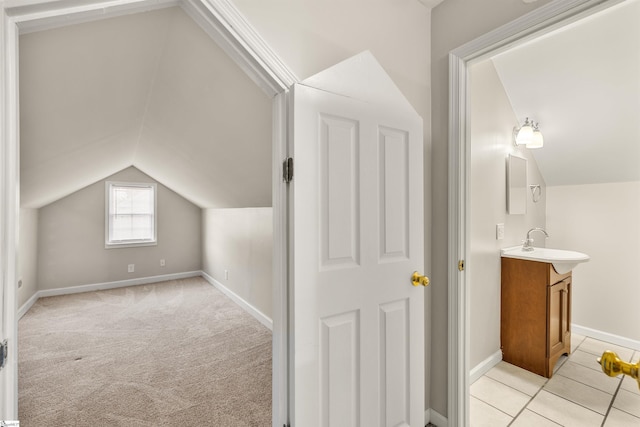 bonus room with light colored carpet, vaulted ceiling, and sink