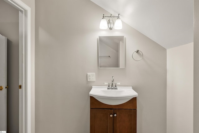 bathroom featuring vanity and vaulted ceiling