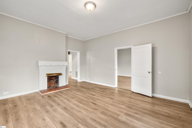 unfurnished living room featuring light hardwood / wood-style floors and ornamental molding