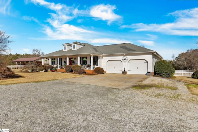 view of front of house with a porch and a garage