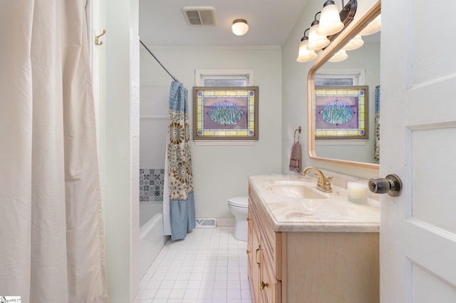 full bathroom with tile patterned flooring, shower / bath combo, vanity, and toilet