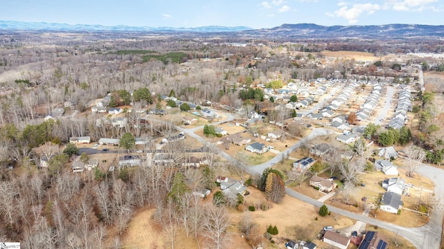 drone / aerial view featuring a mountain view