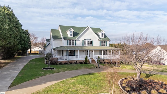 view of front of property with covered porch and a front lawn