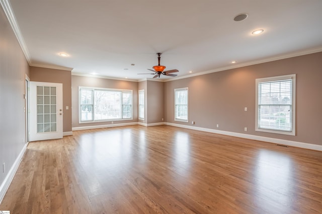 spare room with crown molding, ceiling fan, and light hardwood / wood-style floors